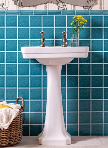 Chroma Romany Green teal coloured square wall tiles behind bathroom sink