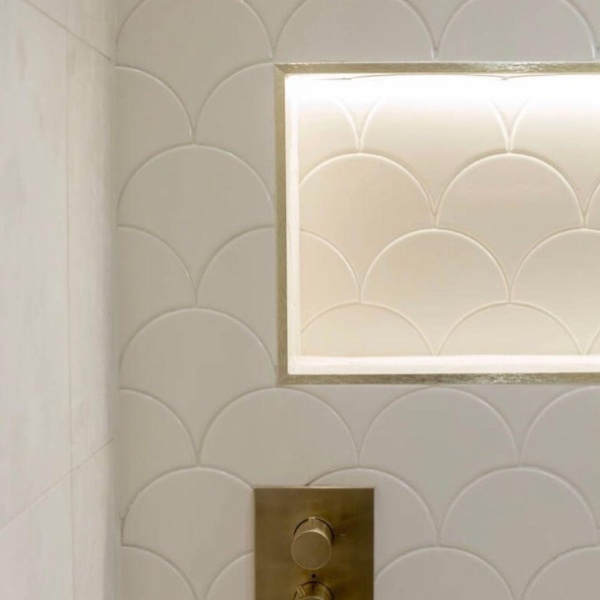 Soho So Linen white scallop wall tiles on a shower by Edinburgh Tile Studio and DCM Construction