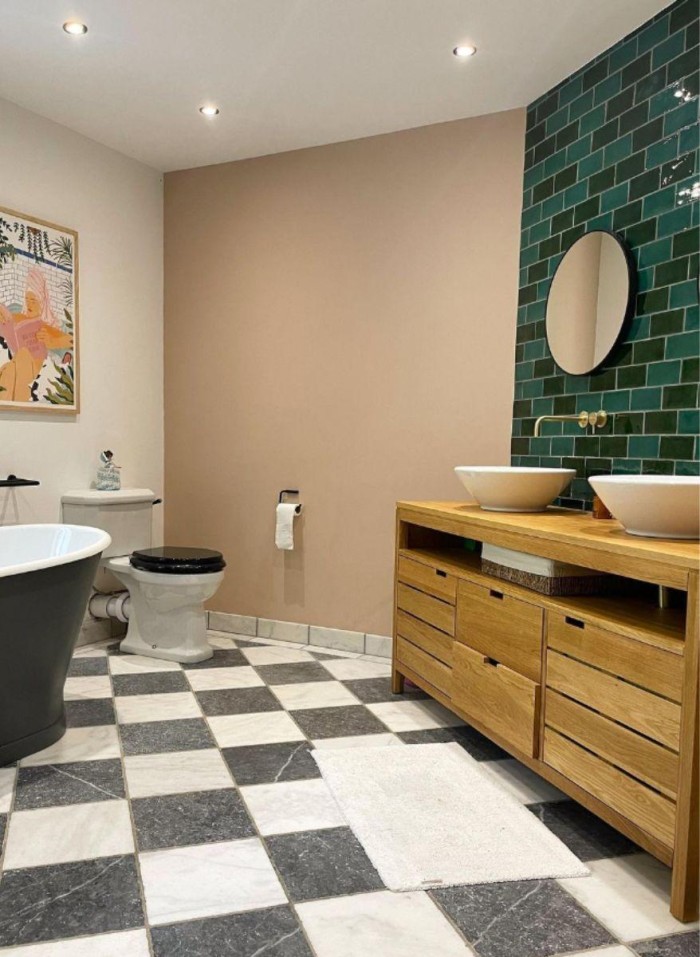 A blend of vibrant green Soho brick tiles behind this modern bathroom vanity unit