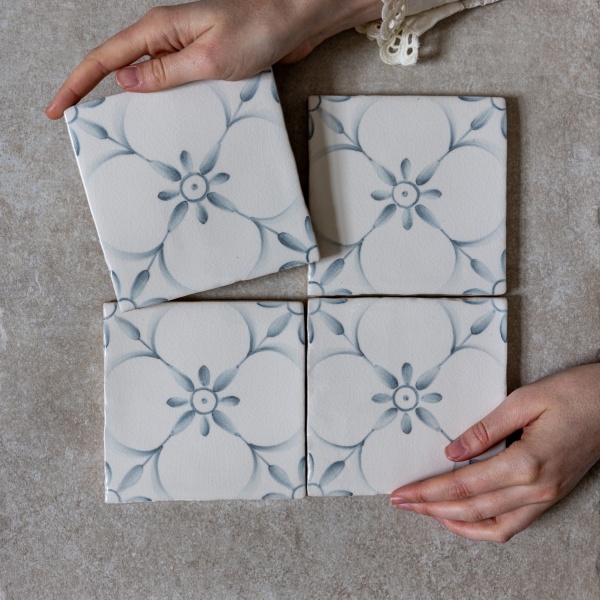 French inspired hand painted patterned tile in soft grey blue