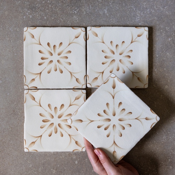 french inspired hand painted patterned tiles in burnt orange