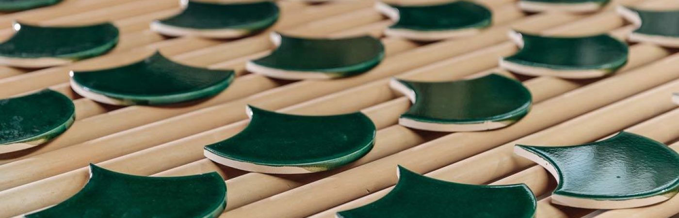 Green scallop tiles exiting the kiln