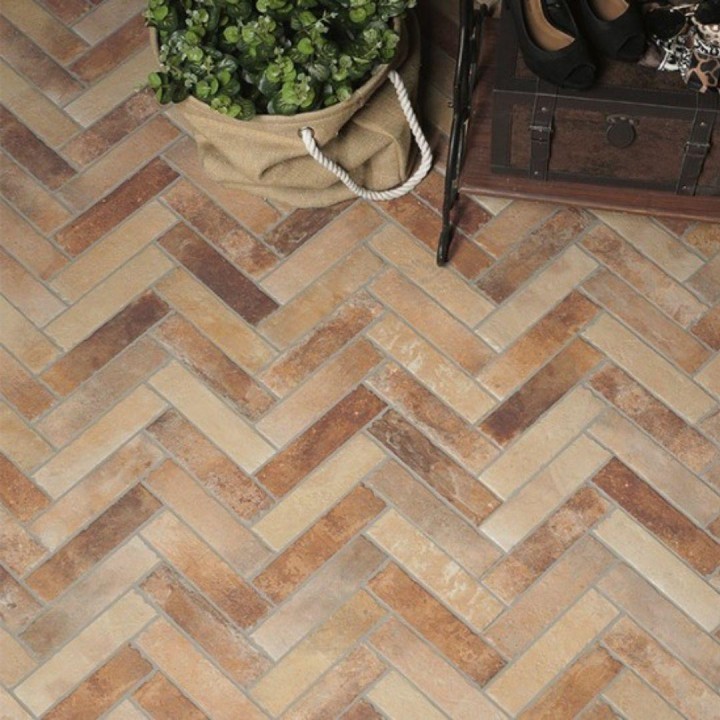 Marlborough Tiles Andalucia parquet terracotta effect floor tiles laid in a herringbone pattern on a floor