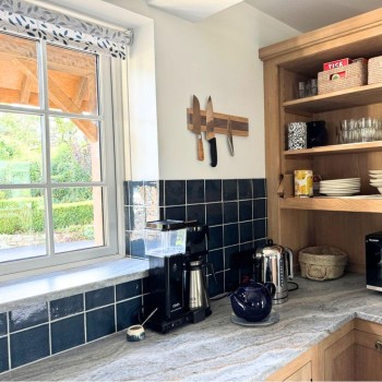 Halcyon Gingham handmade wall tiles in the kitchen of Kim Greenhalgh