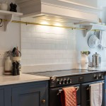 Weir and Webb navy kitchen with Underground Covent Garden wall tiles as a oven backsplash