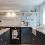 Weir and Webb navy kitchen with Underground Covent Garden wall tiles