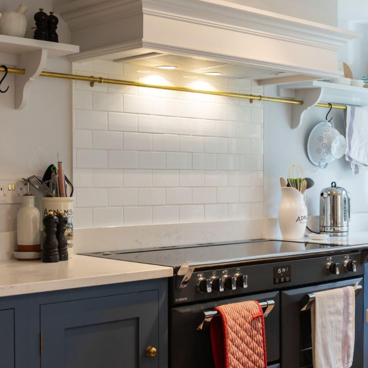 Weir and Webb navy kitchen with Underground Covent Garden wall tiles as a oven backsplash