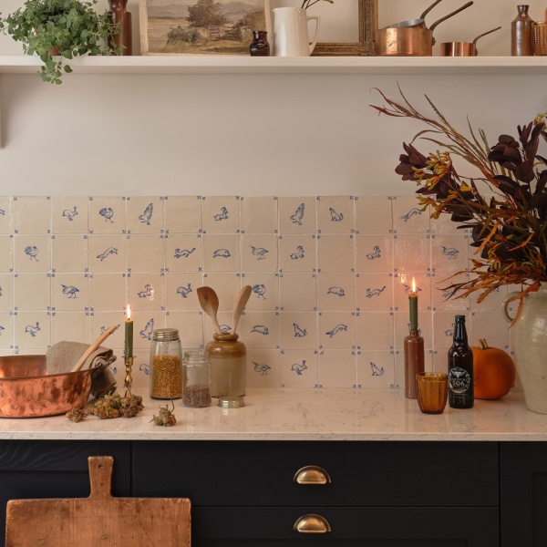 Beautiful dark blue autumnal kitchen with hand painted tiles